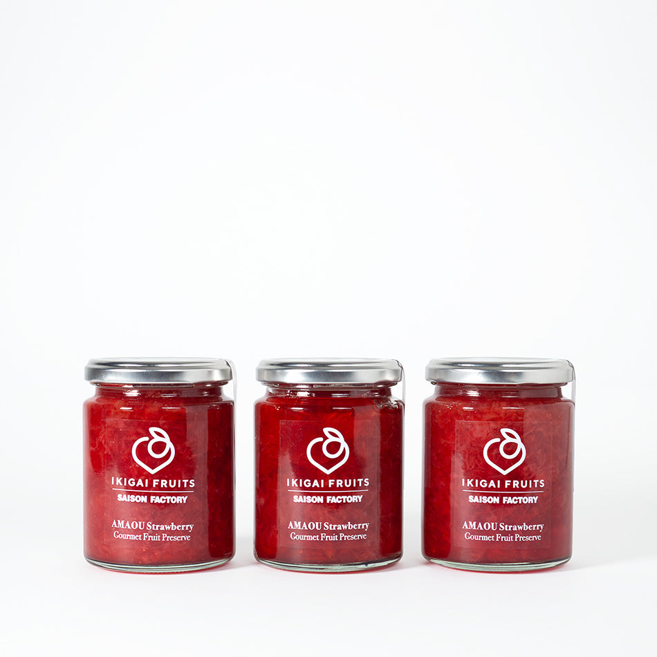 Three bottles of Strawberry preserves