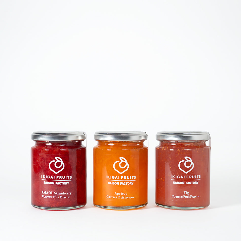 Three bottles of assorted preserves